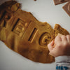 child stamping their name