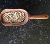 scooper shown with seeds