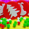 Christmas tree stamp shown with pom poms
