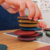 child playing with eco pebbles