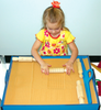 girl rolling sand