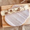 pink playdough shown with rolling pin