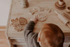 child playing with playdough and cutters