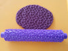 rolling pin shown with dough