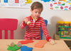 boy playing with stamper and dough