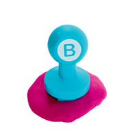 stamper shown with pink playdough