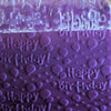 Clear rolling pin engraved with "Happy Birthday" and balloons