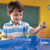 boy playing with dropper in water