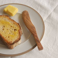 knife shown with toast and butter