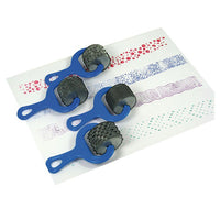 blue handled paint rollers shown with paint on paper