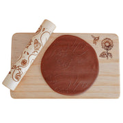 rolling pin shown with board and dough