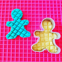 gingerbread shapes shown with playdough and pink mat