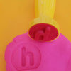 h stamp with pink playdough