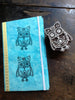 Owl stamp shown on journal cover