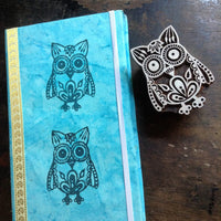 Owl stamp shown on journal cover