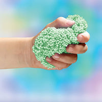 hand with green playfoam