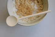 spoon shown with porridge