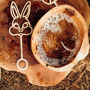 Bunny wand shown with bowl of bubble mix