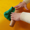 Three-year-old's hands shown on rolling pin