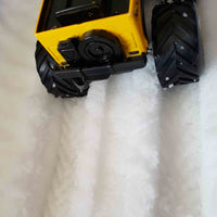 Toy car making tracks in the snow