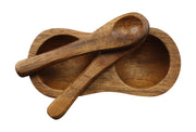 2 spoons on top of a dish