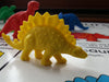 yellow plastic Stegosaurus