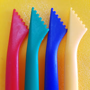 red, green, blue and yellow craft stick tools