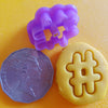 hashtag playdough cutter shown with 50 cent coin