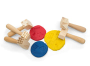 Wooden hammers shown with dough